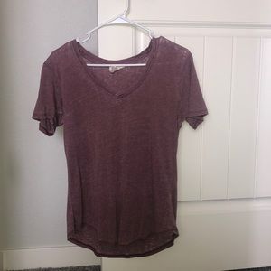 purple v neck shirt